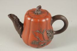 A TERRACOTTA YIXING TEAPOT.