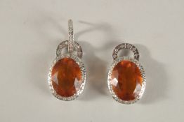 A PAIR OF TOPAZ PENDANTS.