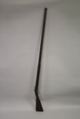 AN 18TH CENTURY FLINTLOCK LONG GUN by H. NOCK. 186cms long.