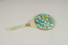 A MAGNIFYING GLASS with enamel back and jade enamel.