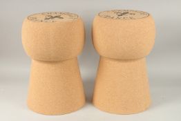 A LARGE PAIR OF CHAMPAGNE CORK SEATS. 50cms high.