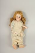 S. F. B. J. FRENCH BISQUE HEADED DOLL, open and shut eyes, articulated body, long hair, clothed.