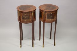 A PAIR OF LOUIS XVITH STYLE MAHOGANY CIRCULAR BEDSIDE TABLES with three small drawers supported on