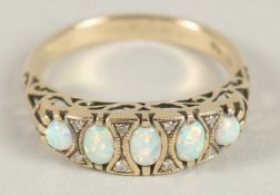 A 9CT GOLD OPAL AND DIAMOND RING.