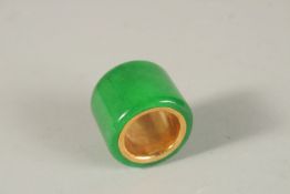 A JADE ARCHER'S RING.