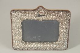 A SILVER PHOTOGRAPH FRAME. 17cms x 21cms.