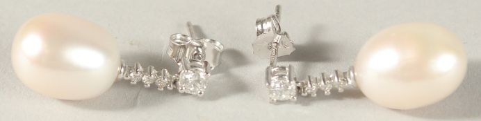 A PAIR OF 18CT WHITE GOLD, PEARL AND DIAMOND DROP EARRINGS.