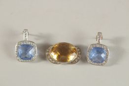 A SMALL PAIR OF BLUE PENDANTS and a topaz pendant (3).