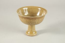 A GREEN GLAZE CIRCULAR STEM CUP. 13cms diameter.