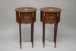 A PAIR OF LOUIS XVITH STYLE MAHOGANY INLAID OVAL BEDSIDE TABLES with three small drawers supported