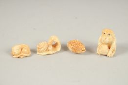 FOUR CARVED BONE NETSUKES.
