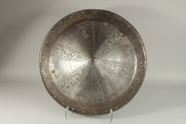 A GOOD LATE 16TH CENTURY ENGRAVED METAL SHIELD. 55cms diameter.