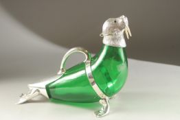 A LARGE GREEN GLASS AND PLATED NOVELTY SEAL DECANTER. 36cms high.
