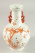 A CHINESE WHITE VASE with orange decoration, birds in almond blossom. Square blue mark.