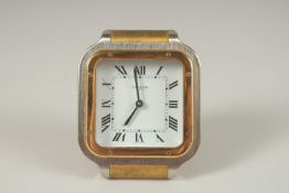 A GOOD CARTIER TRAVELLING CLOCK. Quartz, No. 7508 17637. 7cms x 7cms, in a Red Cartier folding bag.