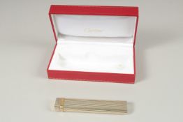 A GOOD CARTIER LONG LIGHTER. Stamped Cartier, Paris, No. 80873. 12.5cms long, in a Red Cartier Box.