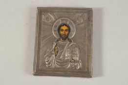 A SMALL RUSSIAN SILVER ICON. 8cms x 7cms.