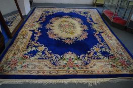 A CHINESE CARPET, blue ground with floral decoration, 380cm x 280cm.