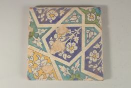 A FINE 18TH-19TH CENTURY INDIAN MULTAN TILE, with geometric designs, 23cm x 23cm.