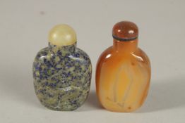 A CHINESE LAPIS SNUFF BOTTLE AND STOPPER, together with an agate snuff bottle and stopper, (2).