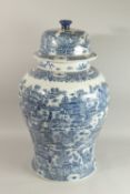 A VERY LARGE CHINESE BLUE AND WHITE PORCELAIN FLOOR STANDING VASE AND COVER, painted with a