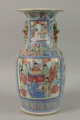 A CHINESE FAMILLE ROSE PORCELAIN TWIN HANDLE VASE, with panels of figures, (af), 43cm high.