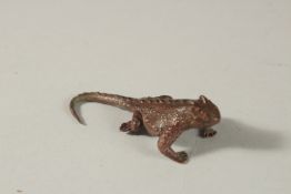 A BRONZE OKIMONO OF A LIZARD.