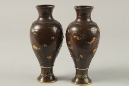 A FINE PAIR OF JAPANESE MEIJI PERIOD MIXED METAL INLAID BRONZE VASES, decorated with gilt and silver
