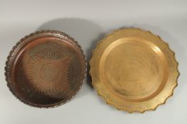 A LARGE PERSIAN ENGRAVED COPPER BOWL, 41.5cm diameter, together with a Tibetan brass tray, (2).