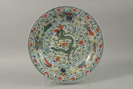 A CHINESE DOUCAI PORCELAIN DRAGON CHARGER, the base with six-character mark, 40.5cm diameter.
