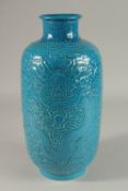 A CHINESE TURQUOISE GLAZE PORCELAIN LANTERN VASE, carved with dragons and stylised clouds, 35cm