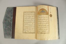 A FINE 17TH CENTURY OTTOMAN LEATHER BOUND QURAN JUZ SECTION, with beautifully gilded illuminated