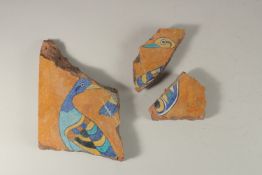 THREE 17TH-18TH INDIAN TILE FRAGMENTS, with bird designs, largest 29cm wide, (3).
