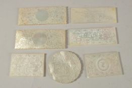 A COLLECTION OF SEVEN 19TH CENTURY CANTONESE ENGRAVED MOTHER OF PEARL COUNTERS, with four Armorial