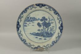 A VERY LARGE CHINESE BLUE AND WHITE PORCELAIN CHARGER, (af), 55cm diameter.