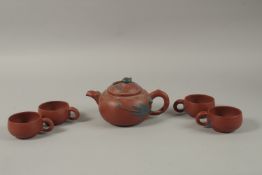 A CHINESE YIXING TEA SET, comprising a teapot and four tea cups (one broken), each piece with