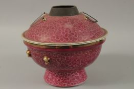 A CHINESE PINK GLAZE PORCELAIN CIRCULAR WARMER AND COVER, 26cm diameter.