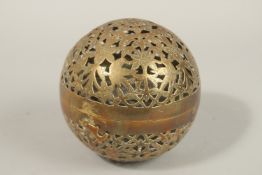 A FINE EARLY 19TH CENTURY MUGHAL NORTH INDIAN OPENWORKED BRASS HAND WARMER, with birds and flower