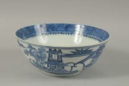 A CHINESE BLUE AND WHITE PORCELAIN BOWL, with four-character mark, 26cm diameter.