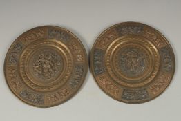 A PAIR OF 19TH CENTURY INDIAN TANJORE SILVER AND COPPER INLAID BRASS DISHES, depicting Hindu