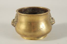 A CHINESE BRONZE OR BRASS TWIN HANDLE CENSER, the base with six-character mark, 7.5cm high.