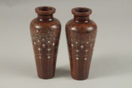 A FINE PAIR OF LATE 19TH CENTURY OTTOMAN TURKISH SILVER INLAID WOODEN VASES, signed and dated to the