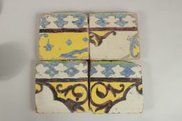 A COLLECTION OF FOUR 18TH CENTURY PERSIAN CUERA SECA POTTERY TILES, (4).