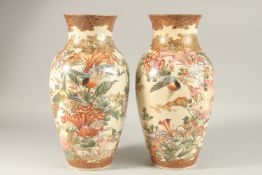 A LARGE PAIR OF JAPANESE SATSUMA VASES, possibly by Kyoto Kinkozan, painted with birds and flora,
