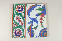A LARGE TURKISH IZNIK GLAZED POTTERY TILE, 27cm square.