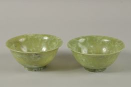 A PAIR OF CHINESE JADE BOWLS, 13cm diameter.