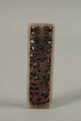 A SMALL CHINESE CARVED AND PIERCED JADE SEAL, 7cm long.