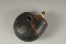 A FINE 18TH-19TH CENTURY MUGHAL INDIAN LEATHER MOUNTED POWDER FLASK, 16cm high.
