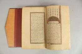 A FINE 19TH CENTURY OTTOMAN LEATHER BOUND MANUSCRIPT, signed Mustafa Rasikh, 23.5cm x 14.5cm.