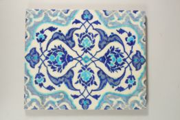 A LARGE TURKISH IZNIK GLAZED POTTERY TILE, 32.5cm x 26.5cm.